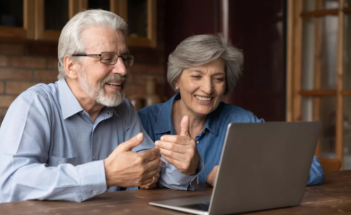  Man and woman in front of open laptop
