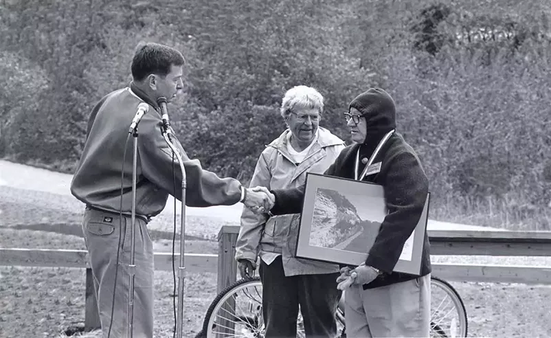 Ted and Pat Jones commemorate the dedication of the Katy Trail State Park with a park ranger.
