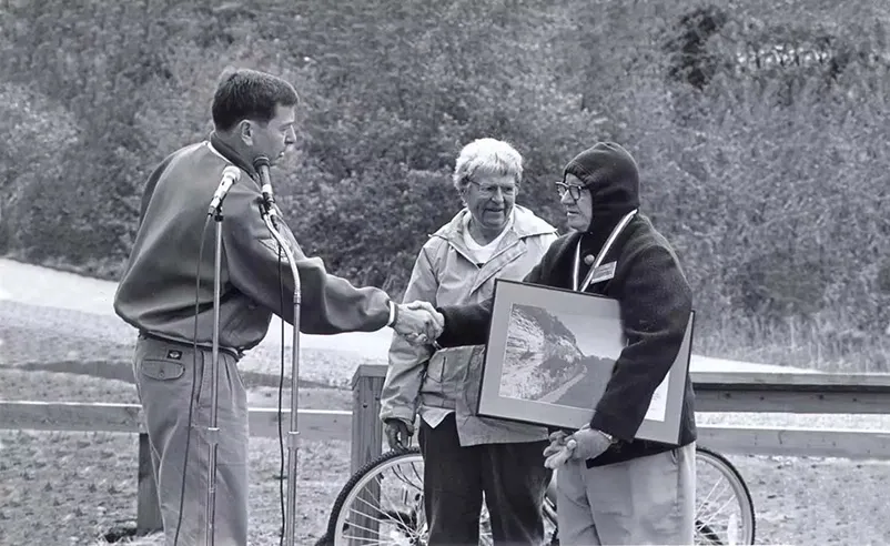 Ted and Pat Jones commemorate the dedication of the Katy Trail State Park with a park ranger.