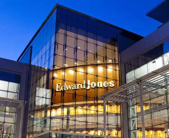  The Edward Jones Headquarters building, lit up at nighttime.
