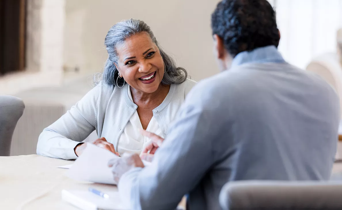 Woman discussing charitable giving with financial advisor