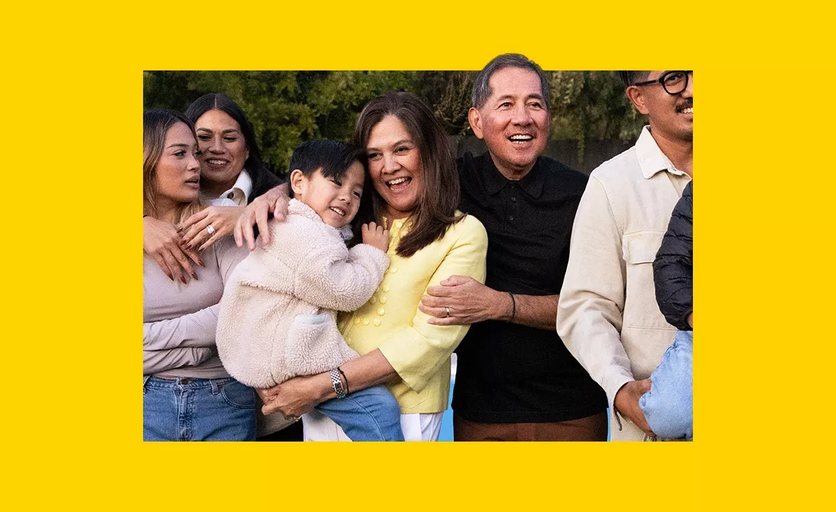  Image Alt Tag (content to inform SEO and accessibility) Family gathering and hugging each other with decorative yellow border.
