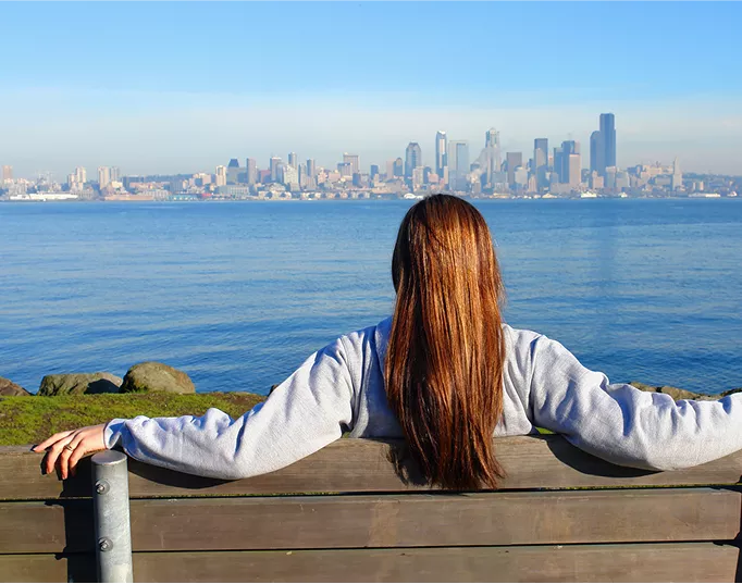  Woman seated on bench in Puget Sound
