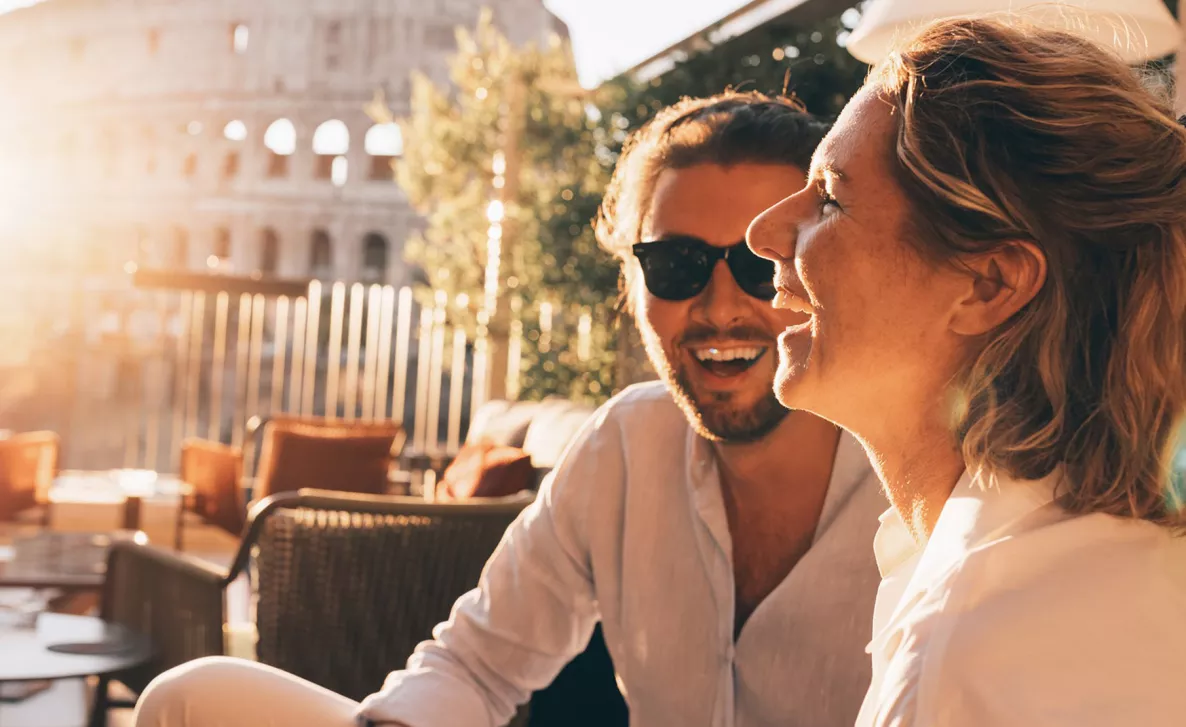  Side view of a man and woman laughing
