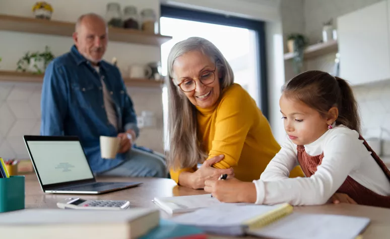 An Old couple teaching their grand daughter An Old couple teaching their grand daughter