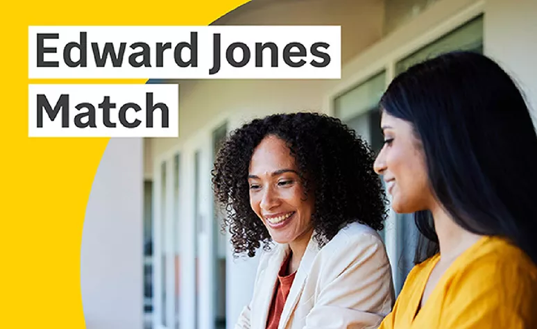Two women colleagues talking near a window. Two women colleagues talking near a window.
