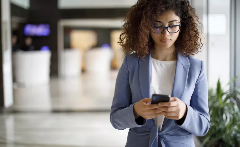 An Edward Jones client is creating a text message on her mobile phone. An Edward Jones client is creating a text message on her mobile phone.