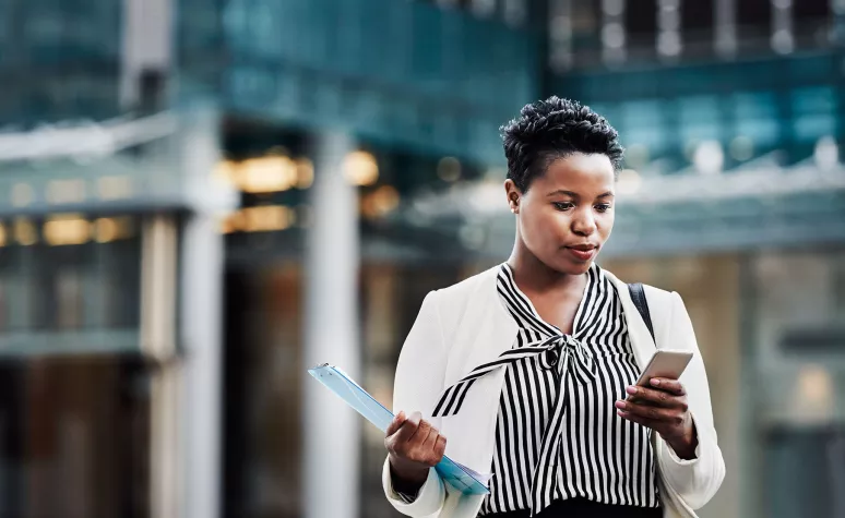 A woman uses mobile banking. A woman uses mobile banking.