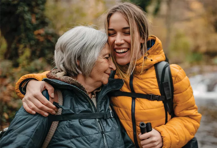 Two people embracing, smiling