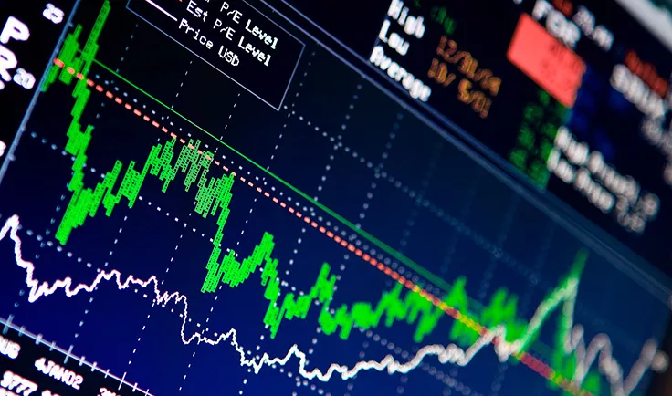 Close-up of a stock trading screen with green and white price lines.