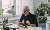 A woman looking at tablet