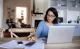 An Edward Jones client uses the retirement calculator to plan her financial future.